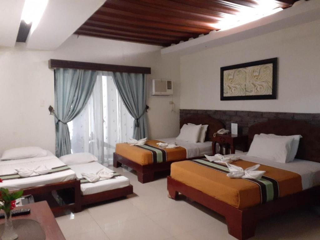 Postel nebo postele na pokoji v ubytování MelSol Hotel