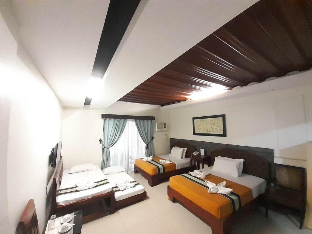 Postel nebo postele na pokoji v ubytování MelSol Hotel