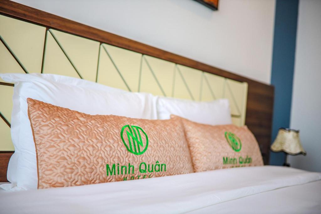 Postel nebo postele na pokoji v ubytování Minh Quan Hotel - Da Nang Center By HOS