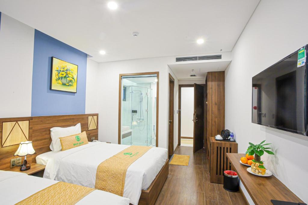 Postel nebo postele na pokoji v ubytování Minh Quan Hotel - Da Nang Center By HOS