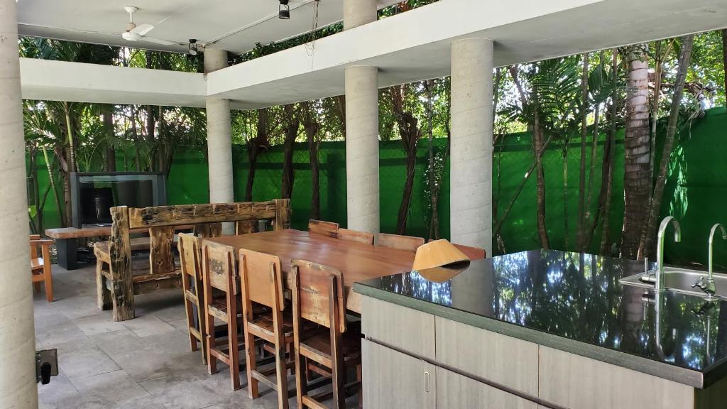 a patio with a table and chairs and a sink at Fu Wan Cafe Villa in Donggang