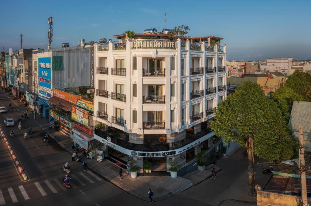 an overhead view of a white building on a street at Ngon Avatar Hotel in Pleiku