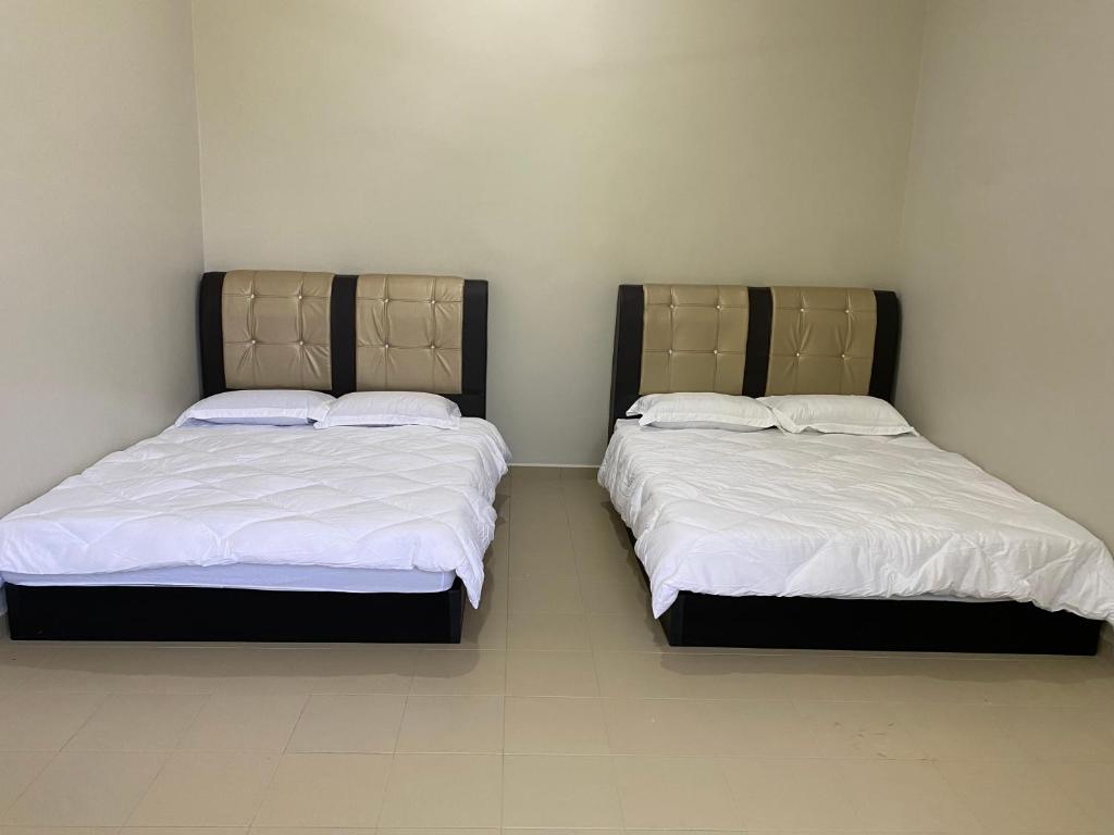 Postel nebo postele na pokoji v ubytování Sasuka Guesthouse (Muslim Sahaja)