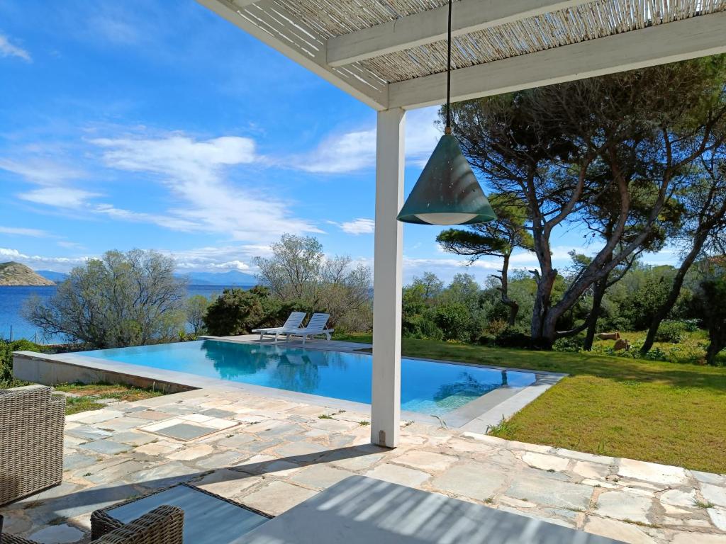 a view of a swimming pool from a house at Summer Villa in Porto Rafti in Porto Rafti