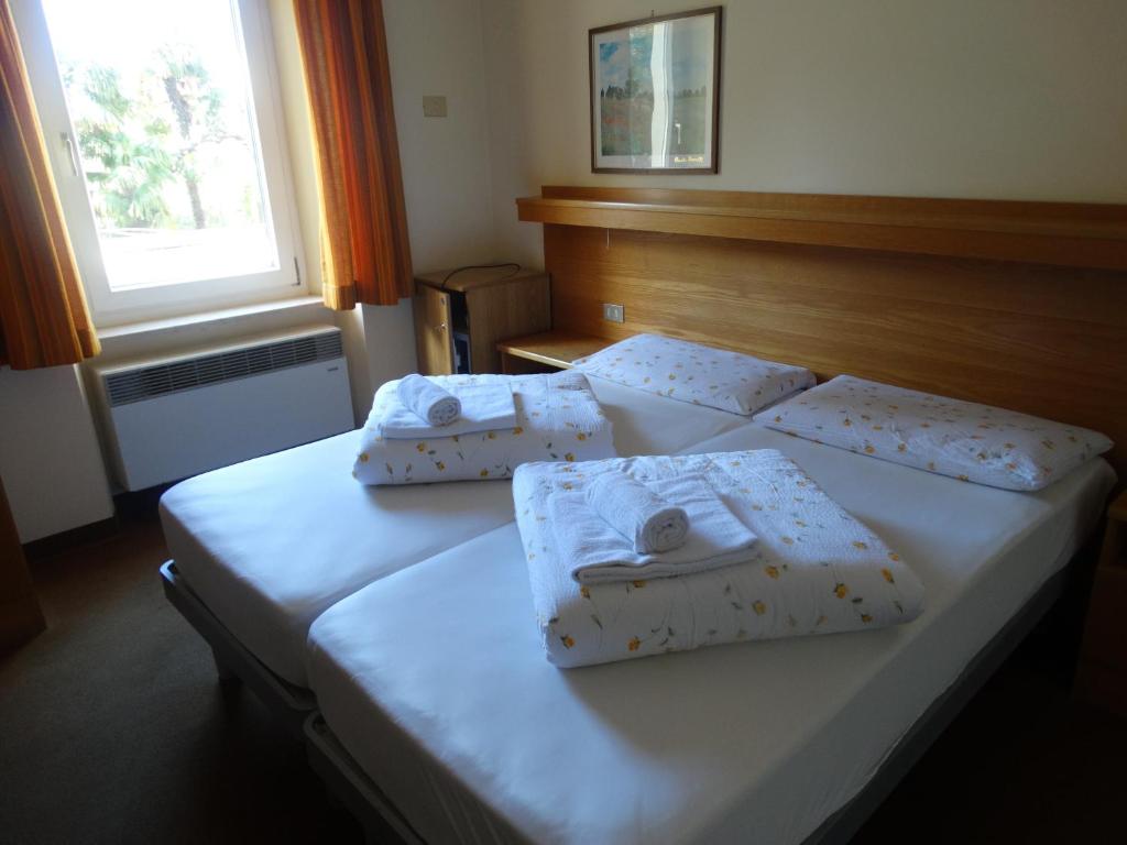 Postel nebo postele na pokoji v ubytování Garnì Ischia