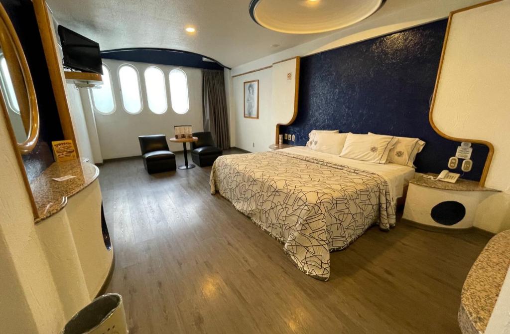 Ένα ή περισσότερα κρεβάτια σε δωμάτιο στο HOTEL MARQUES DEL PEÑON
