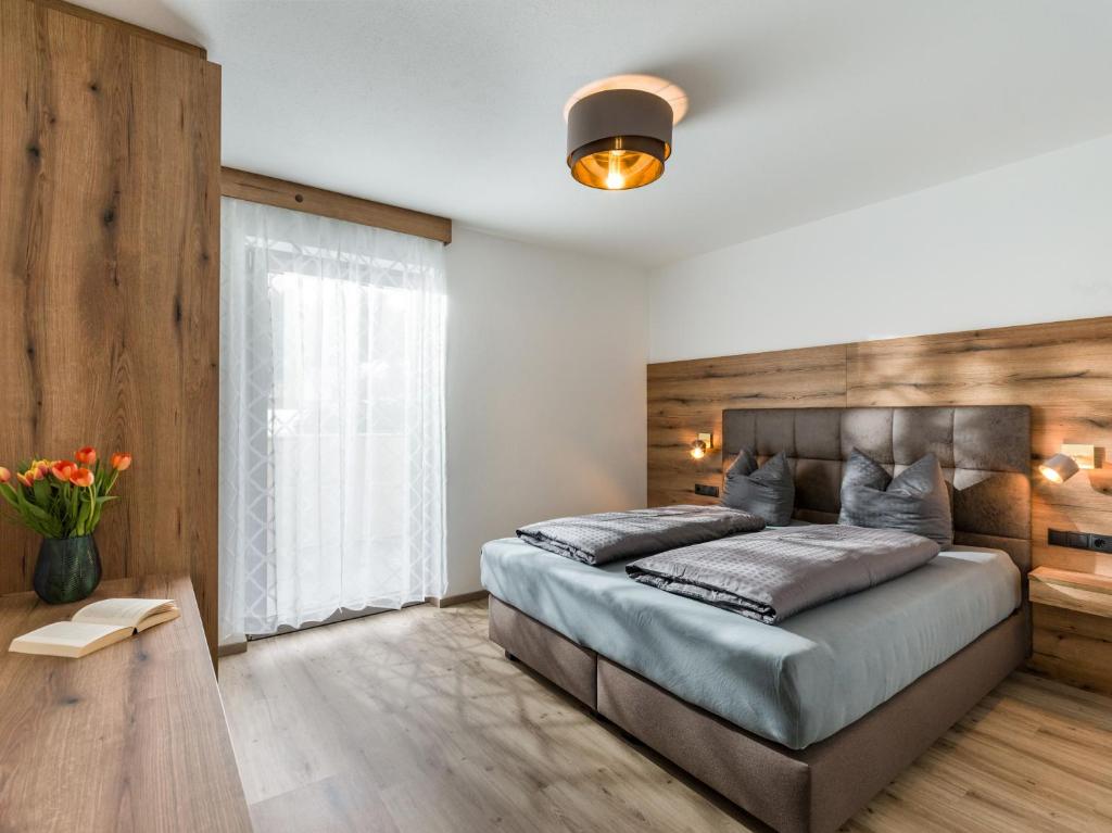 Postel nebo postele na pokoji v ubytování Ledermaier Loft & Lodge`s eU