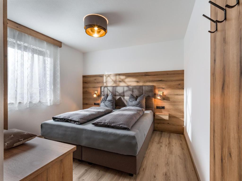 Postel nebo postele na pokoji v ubytování Ledermaier Loft & Lodge`s eU