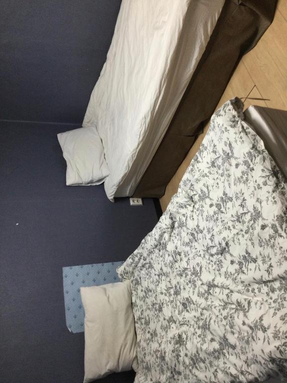Postel nebo postele na pokoji v ubytování G Mini Hotel Dongdaemun