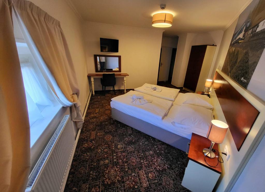 Łóżko lub łóżka w pokoju w obiekcie City-Inn