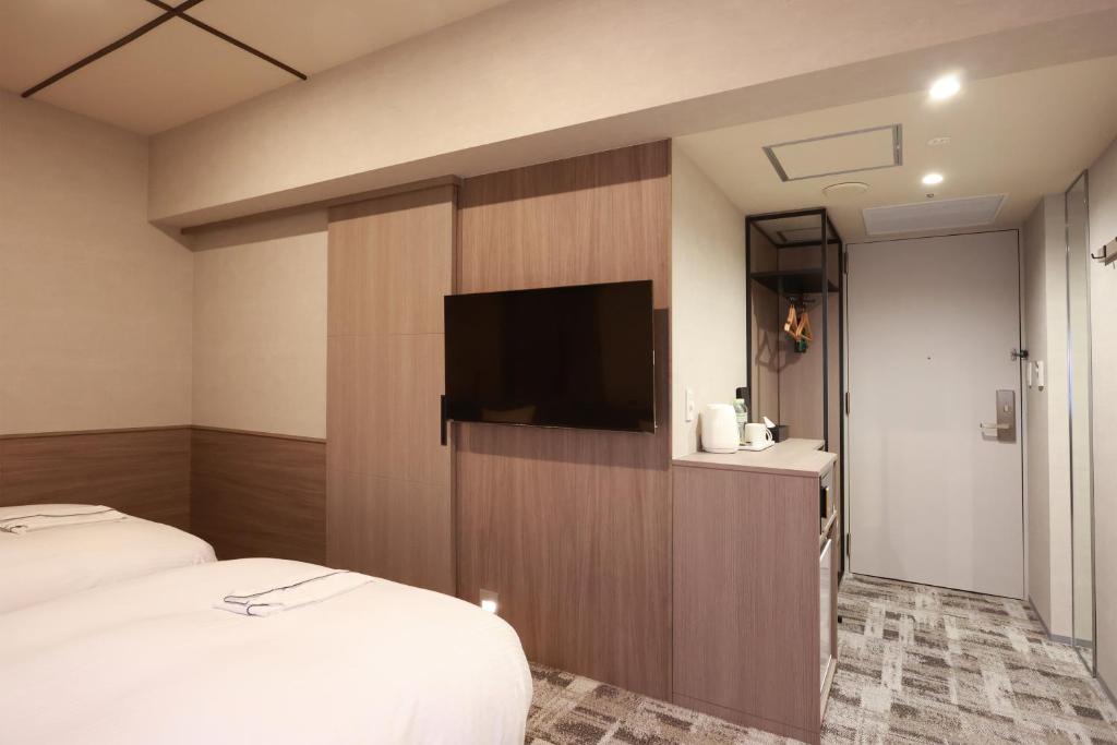TV a/nebo společenská místnost v ubytování SK HOTEL Kobe Ekimae