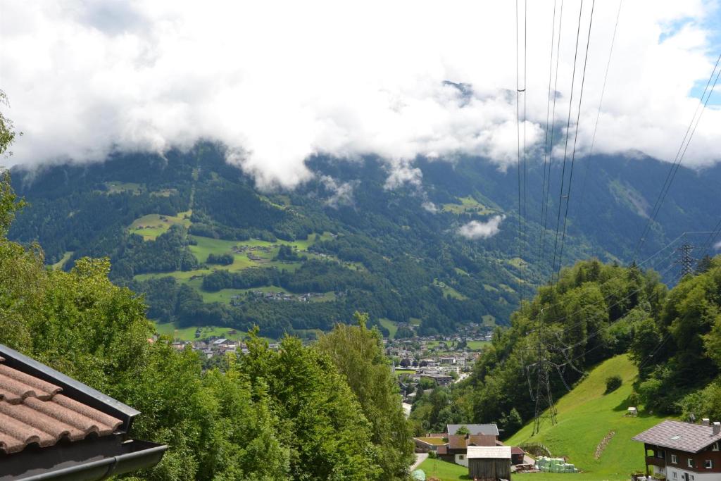 a view of a valley in the mountains at Ruhepol in Schruns