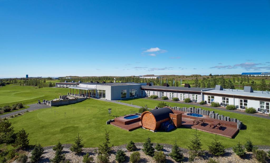 an aerial view of a building with a large yard at Hotel Hamar in Borgarnes