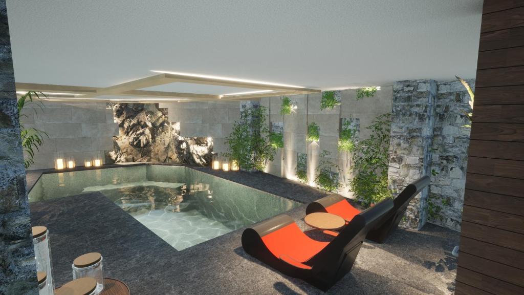 una piscina con banco, mesa y sillas en Mikro Papigo 1700 Hotel & Spa en Papigo