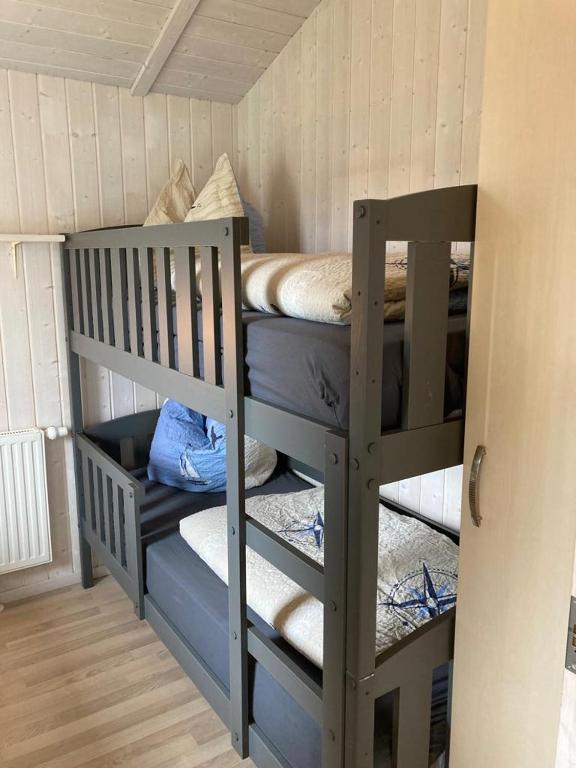 Postel nebo postele na pokoji v ubytování Kapitänshus-Strandpark 24