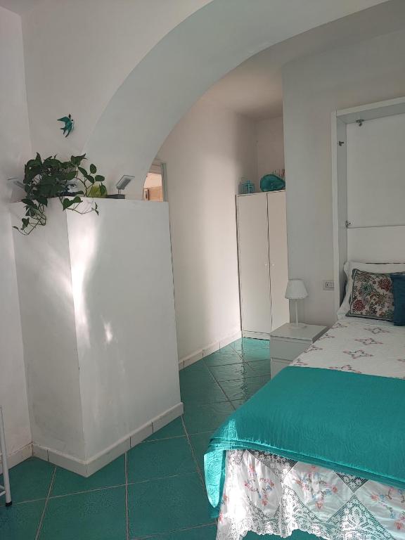 Posteľ alebo postele v izbe v ubytovaní Amalfi Small Wonder Tiny Town House