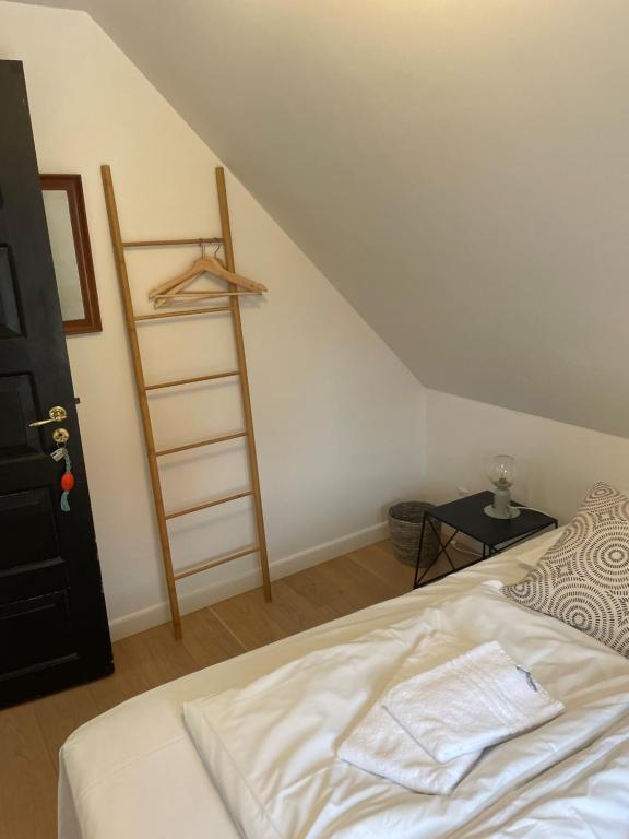 Postel nebo postele na pokoji v ubytování KEFS Guesthouse & Café
