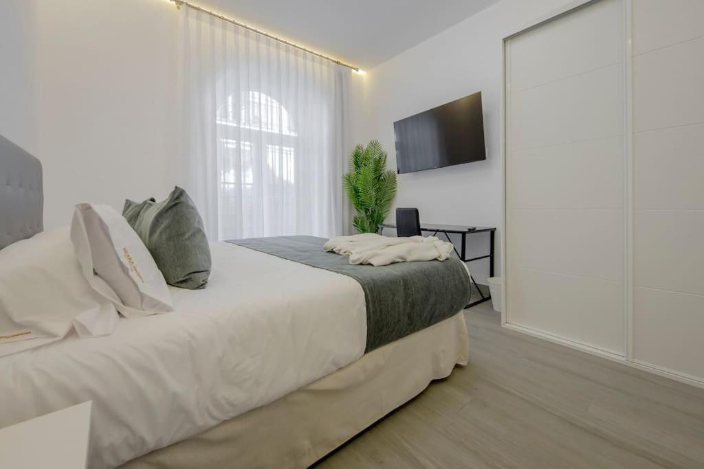 Postel nebo postele na pokoji v ubytování SUARA Apartamentos 2