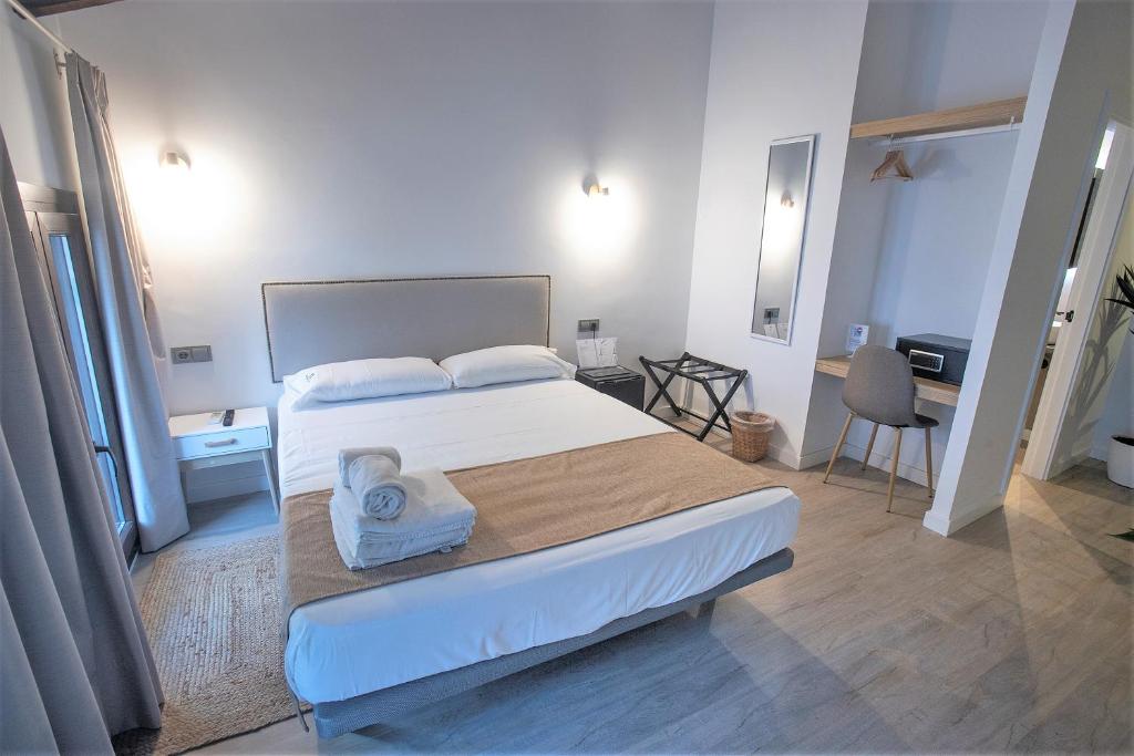 A bed or beds in a room at Vitium Córdoba