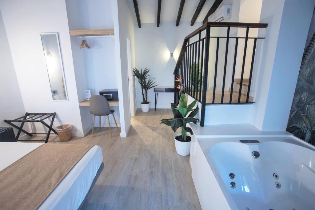 A bed or beds in a room at Vitium Córdoba