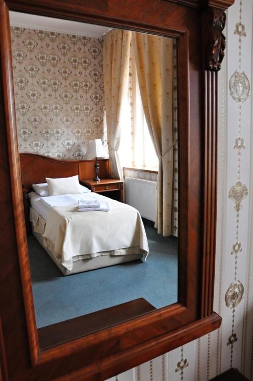 Posteľ alebo postele v izbe v ubytovaní Hotel MERTIN