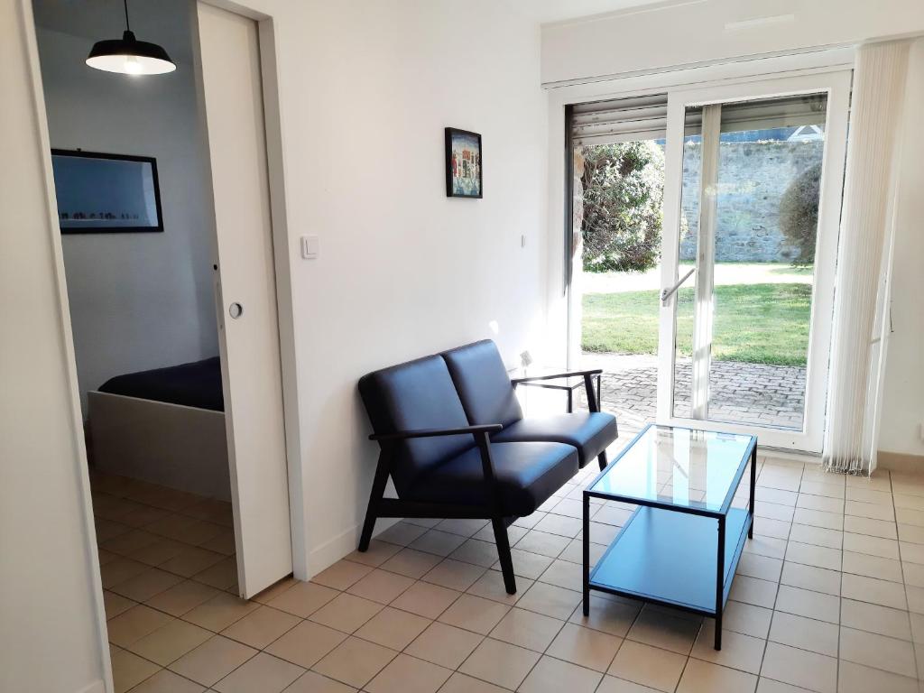 Posedenie v ubytovaní Ty Cocoon- Appartement avec terrasse et parking privé