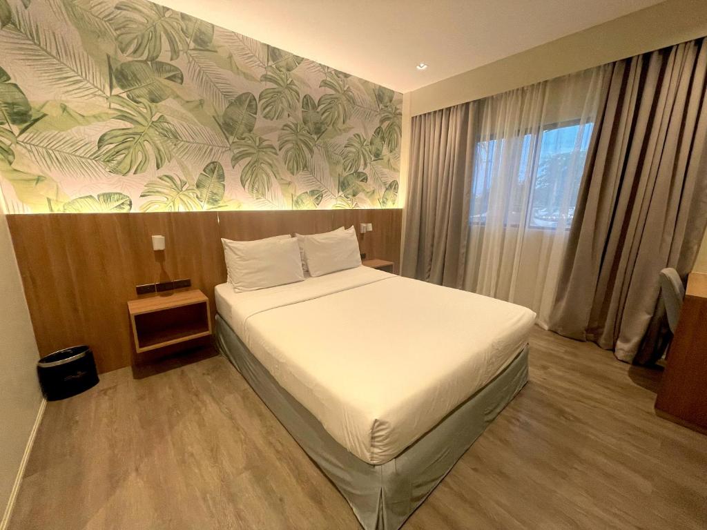 Postel nebo postele na pokoji v ubytování Luisita Central Park Hotel