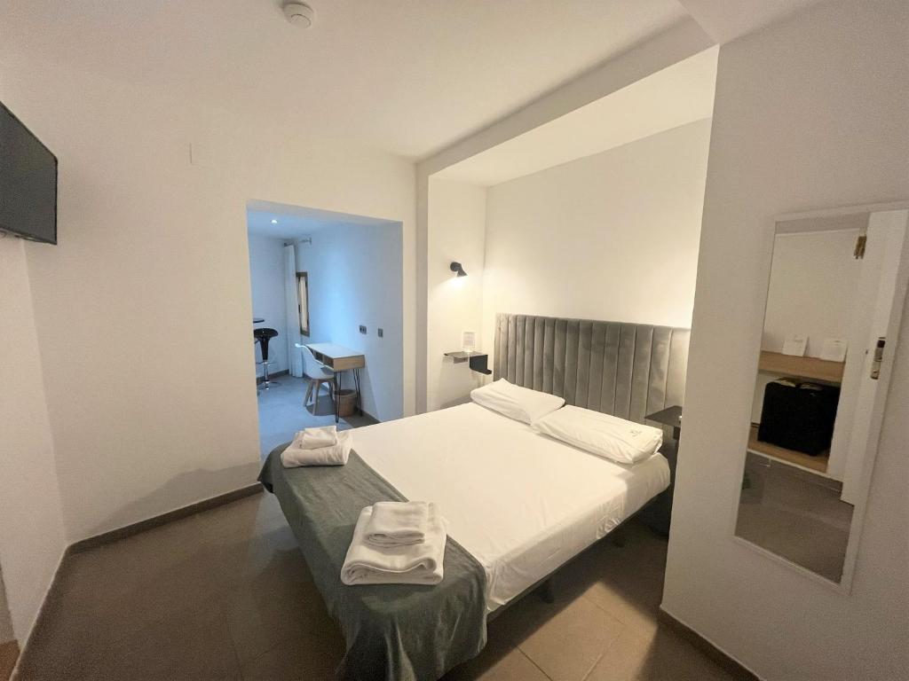 A bed or beds in a room at Vitium Córdoba