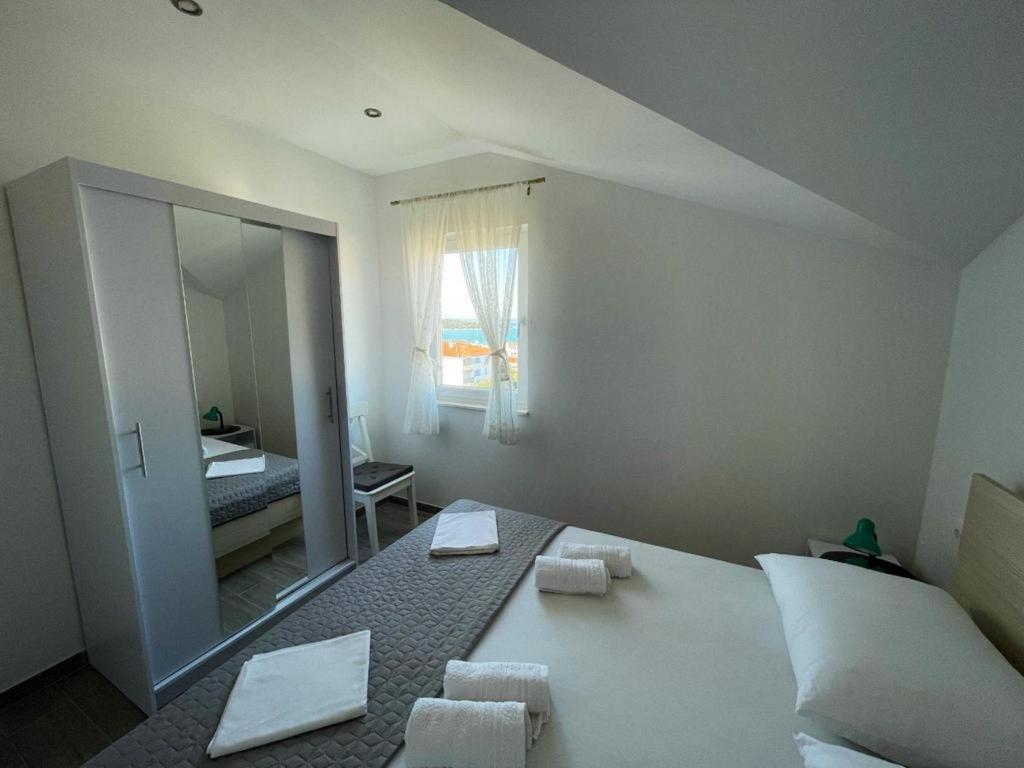 Posteľ alebo postele v izbe v ubytovaní Apartments Kostelic