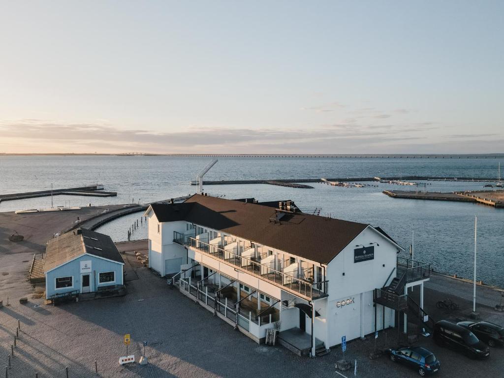 an aerial view of a house next to the water at Hotell Hamnen in Färjestaden