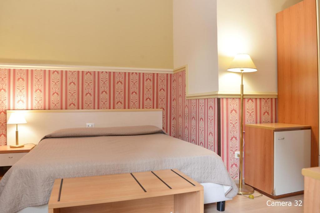 Posteľ alebo postele v izbe v ubytovaní Catania Centro Rooms