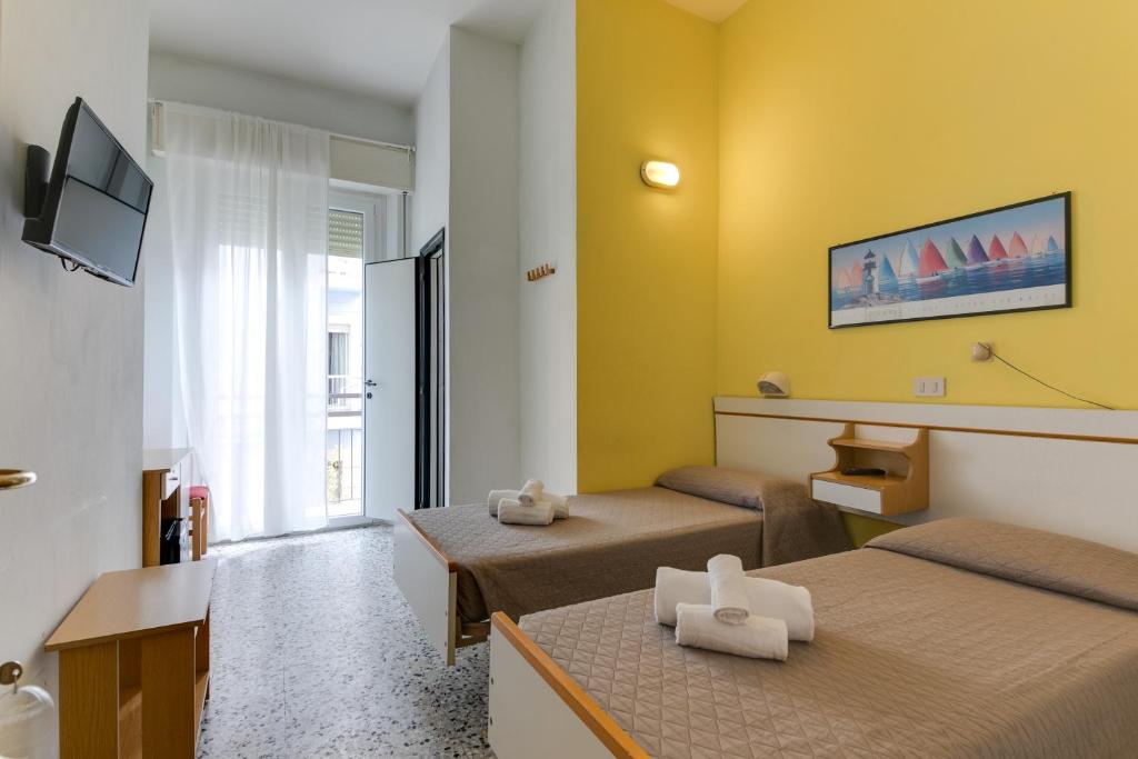 TV a/nebo společenská místnost v ubytování Hotel Villa Merope