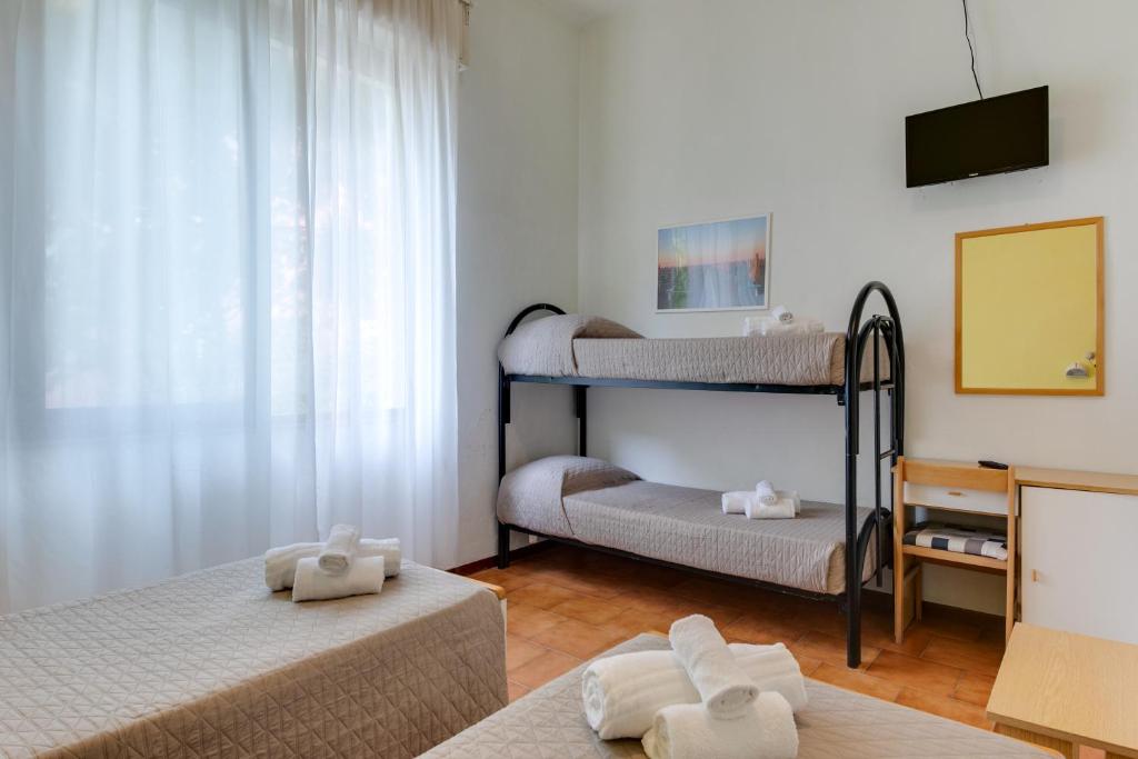 Postel nebo postele na pokoji v ubytování Hotel Villa Merope