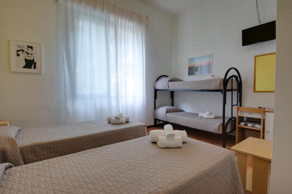 Postel nebo postele na pokoji v ubytování Hotel Villa Merope