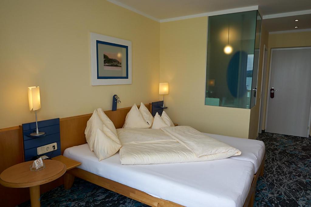 Postel nebo postele na pokoji v ubytování Hotel Seewirt
