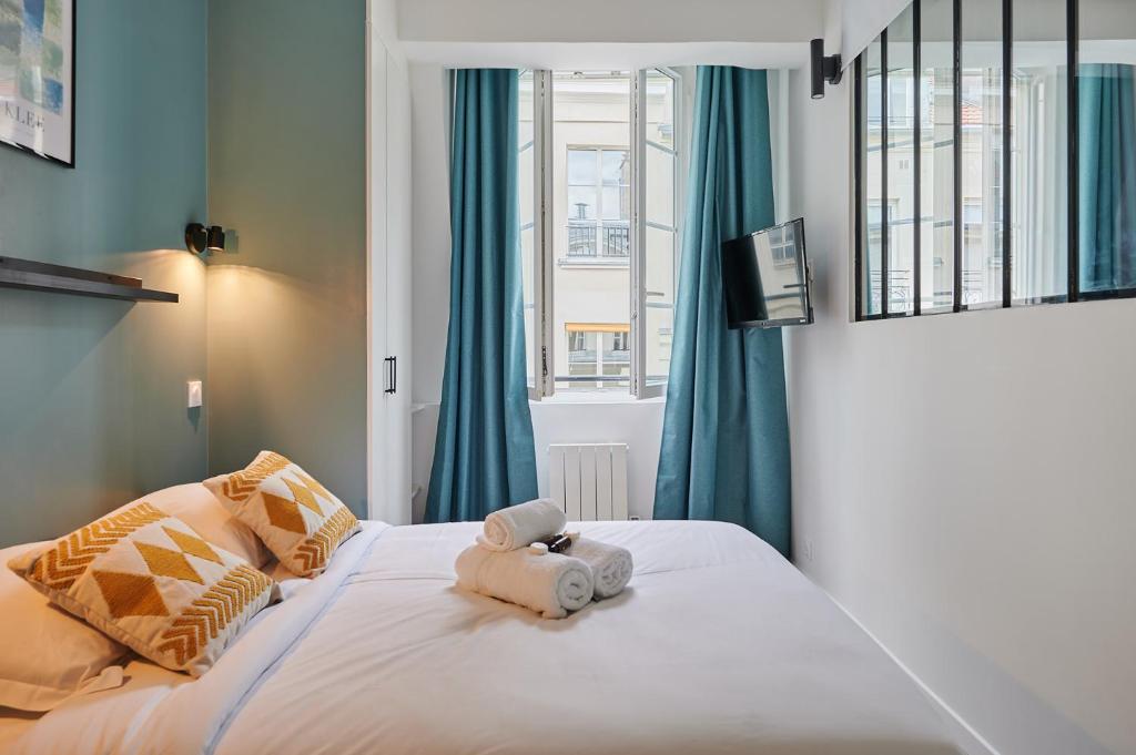 Posteľ alebo postele v izbe v ubytovaní Residence Center of Paris by Studio prestige