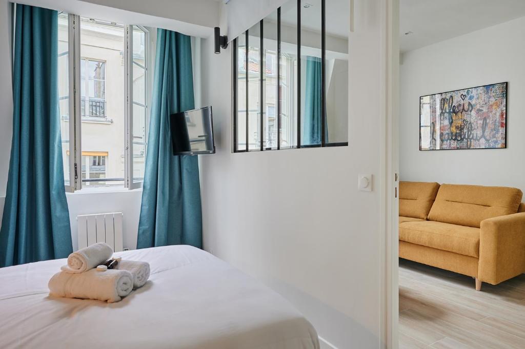 Posteľ alebo postele v izbe v ubytovaní Residence Center of Paris by Studio prestige