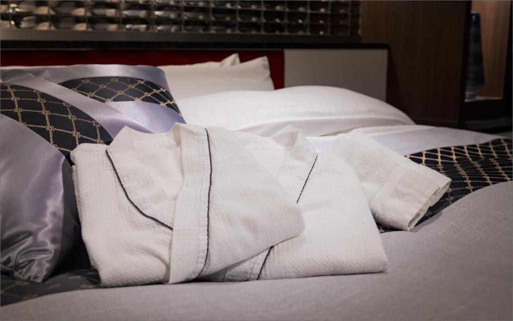 Postel nebo postele na pokoji v ubytování HOTEL KABUKI