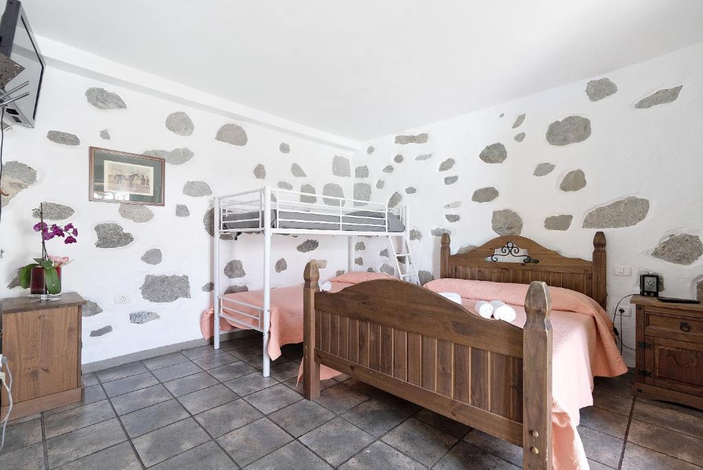 Postel nebo postele na pokoji v ubytování Vivienda Vacacional Risco Blanco