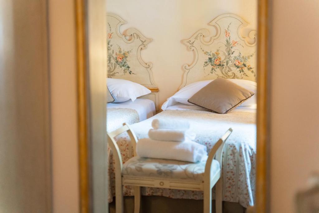 Postel nebo postele na pokoji v ubytování Agriturismo Vecchio Borgo Di Inalbi