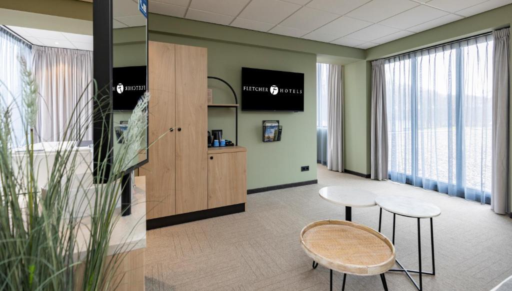 TV a/nebo společenská místnost v ubytování Fletcher Hotel-Restaurant Marknesse