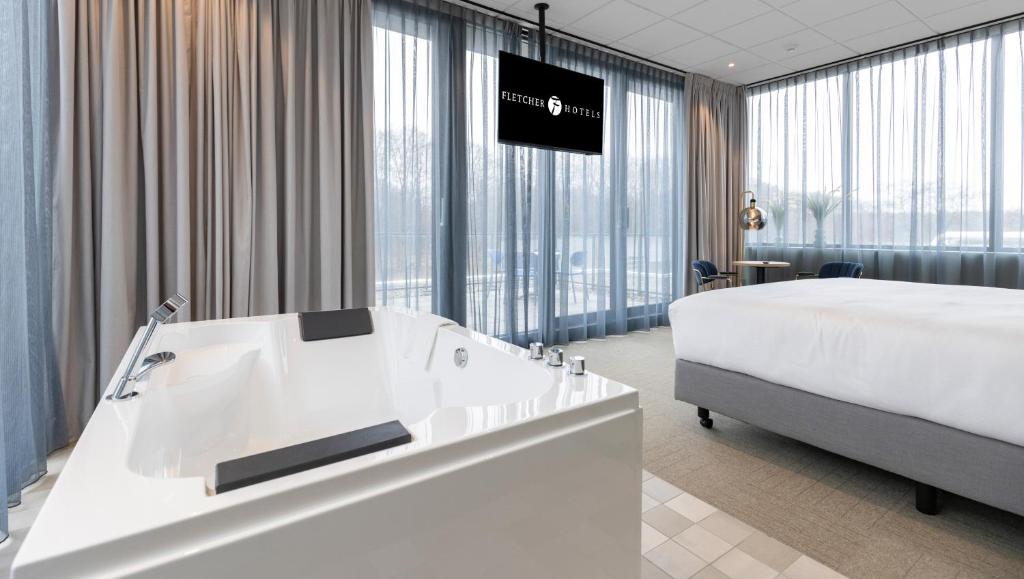 Postel nebo postele na pokoji v ubytování Fletcher Hotel-Restaurant Marknesse