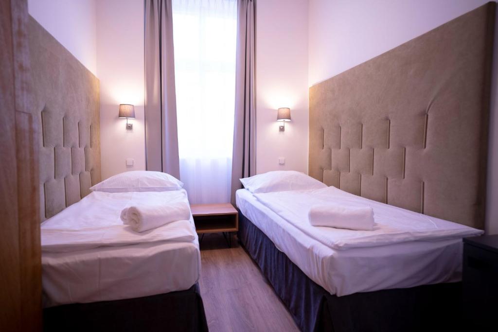 Ένα ή περισσότερα κρεβάτια σε δωμάτιο στο Hotel PAYER II