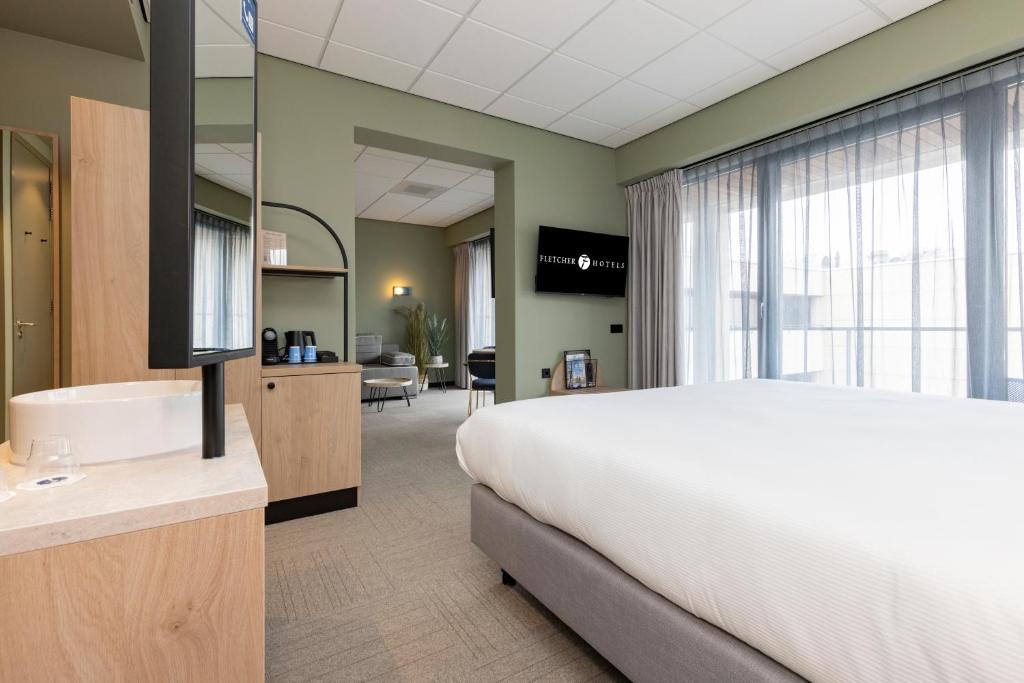 Postel nebo postele na pokoji v ubytování Fletcher Hotel-Restaurant Marknesse