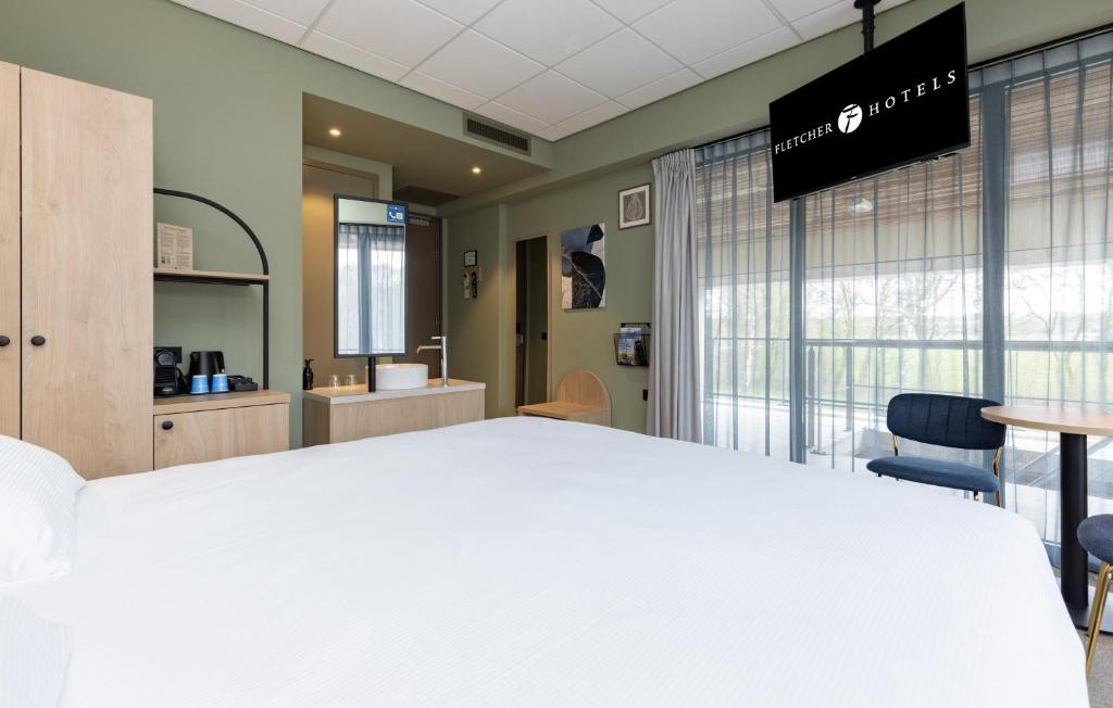 Postel nebo postele na pokoji v ubytování Fletcher Hotel-Restaurant Marknesse