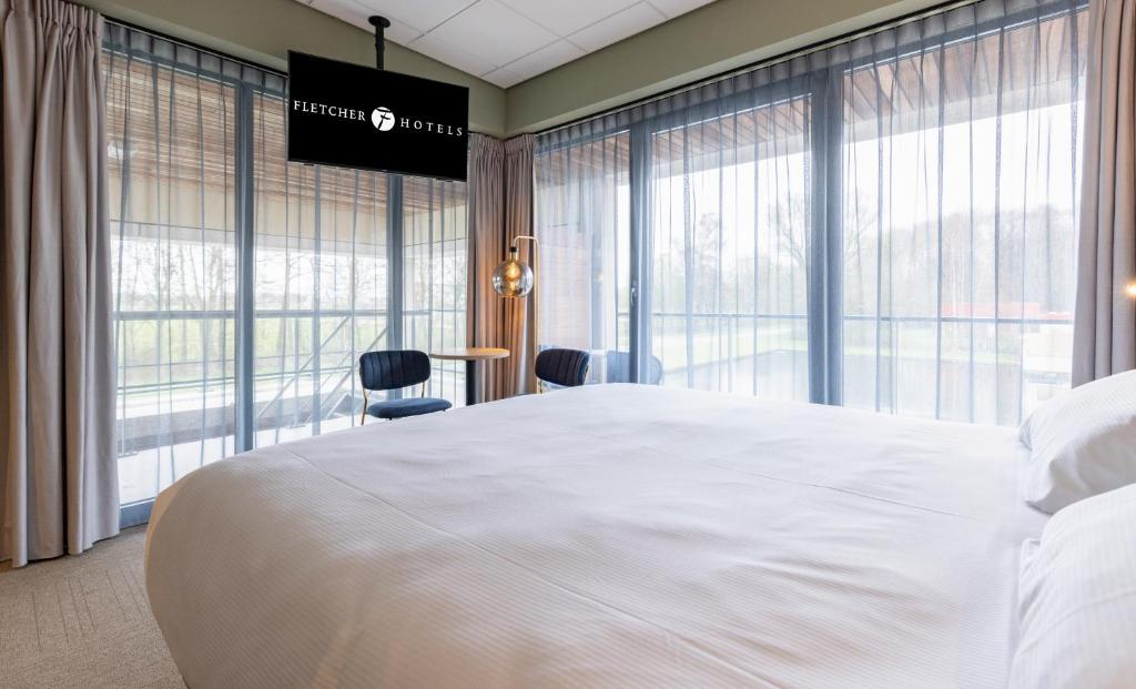 Postel nebo postele na pokoji v ubytování Fletcher Hotel-Restaurant Marknesse