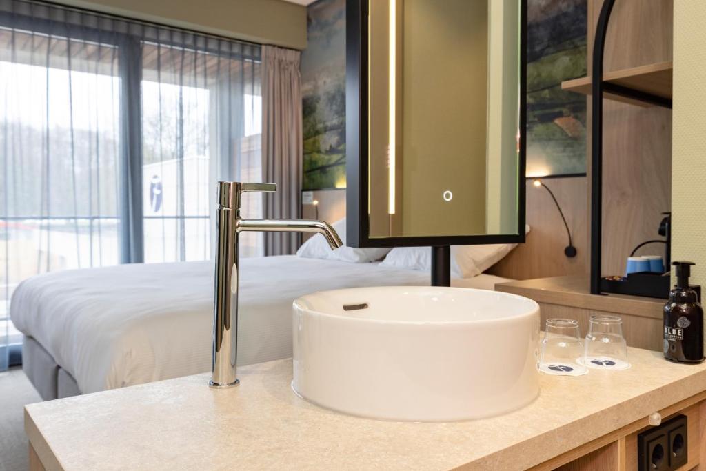 Postel nebo postele na pokoji v ubytování Fletcher Hotel-Restaurant Marknesse