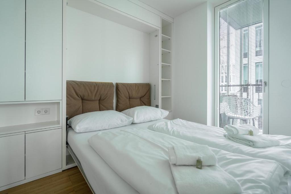 Łóżko lub łóżka w pokoju w obiekcie easy flat Green Prater