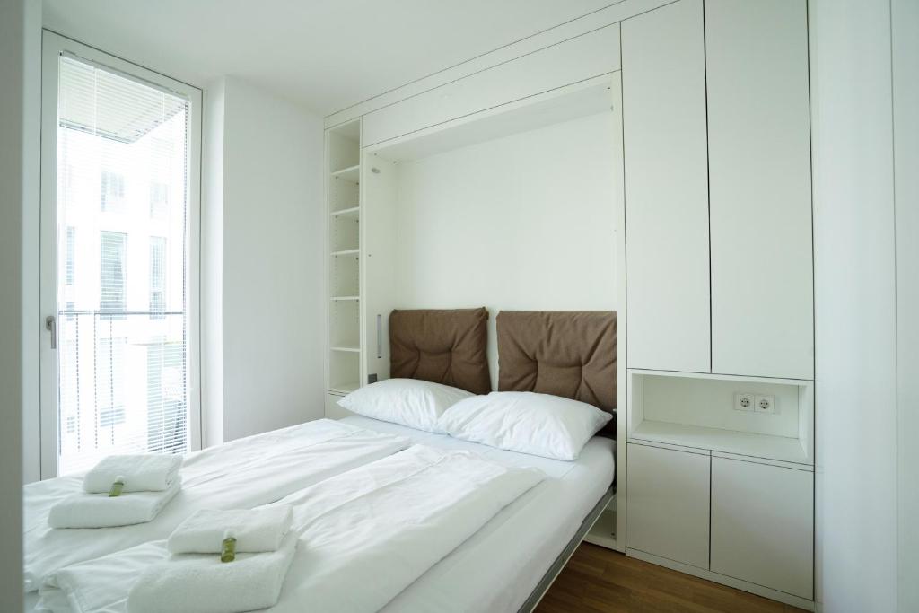 Łóżko lub łóżka w pokoju w obiekcie easy flat Green Prater