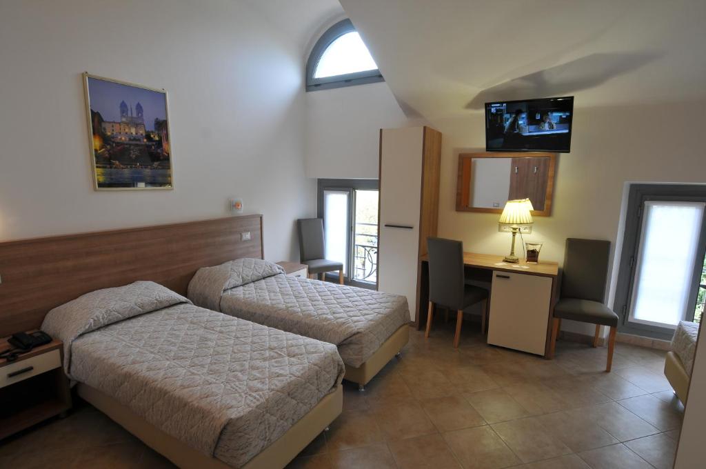 Postel nebo postele na pokoji v ubytování Hotel Montecarlo